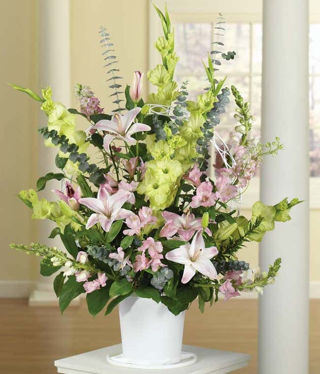 Green &amp; Pink funeral flowers delivered by florist.